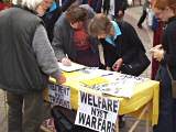 Shoppers sign the Peace Group's petition