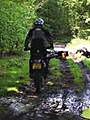 Off-road biker using rutted green lane