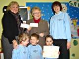 Jane Leach, Lis Kay and Melanie with some of the Children and the Money