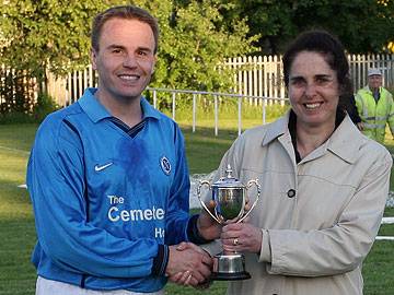 Rochdale Online MD Pauline Journeaux presents the RO runners up Cup to H&H Captain