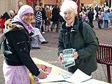 Pat Sanchez of High Peak, Littleborough explaining to a young supporter why she thinks people should sign the petition against Trident replacement.