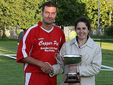 Rochdale Online MD Pauline Journeaux presents the RO Cup to Copperpot Captain