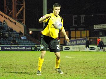 On defence: Simon Ramsden controls the ball