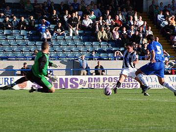 Chris Dagnall takes a first half shot