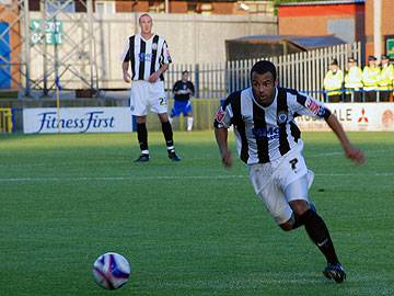 Ben Muirhead runs at the Oldham defence