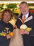 Councillor Alan Taylor, Leader of the Council, using a sustainable Bag for Life to buy fruit and vegetables without packaging from Paul Smedley at Paul's Fruit and Veg stall in Rochdale Market