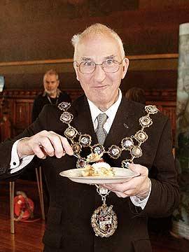 Time out, Mayor Peter Evans samples the Apple Pie.