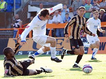 Dagnall is felled in the box by Ismail Yakubu for what Keith Hill believed was a nailed-on penalty