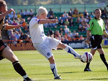 David Perkins fires in a shot; one of few for Rochdale