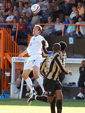 Glenn Murray wins a header