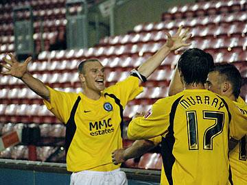 The Dale players celebrate their late equaliser