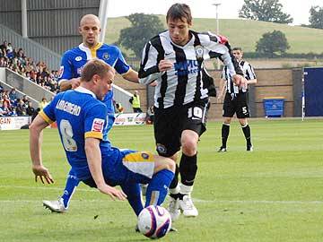 Le Fondre appears to be felled by Langmead but the referee booked Le Fondre for diving