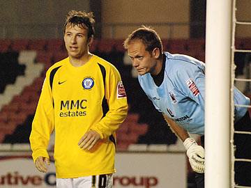 Discussing the 'diving' incident? Adam Le Fondre and Andy Oakes