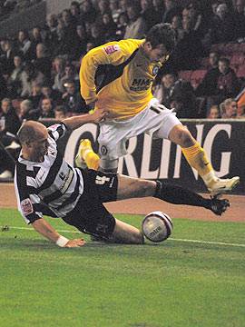 Alan White tackles Le Fondre on the touchline