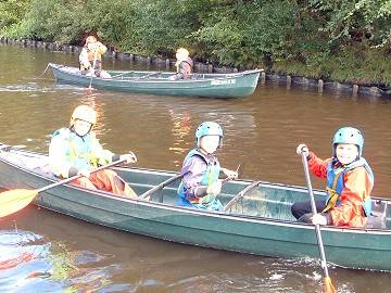 David and Ross, aged 9 and James, aged 8 canoe on the Rochdale Canal