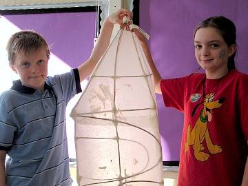 Helen, aged 12 and Daniel, aged 10 show off their lantern