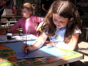 Abigail, aged 8 and Rebecca, aged 3 paint their lantern designs