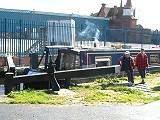 Canal boat passes through a lock on the Rochdale Canal