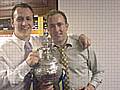 Spotland Methodists Football Club members - Mark Buffery and Chris Watson - proudly holding the Trophy