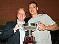 John Luker of Copperpot receives the Rochdale Online League trophy from Wayne Melvin of Carcraft