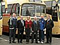 Pictured in between two Yelloway drivers are Hornets' chairman David Vining, commercial director Karen Reynolds, chief executive Peter Whitehead and kit manager Mark Reynolds, who organized the occasion.