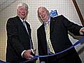 Rochdale MP Paul Rowen cuts the ribbon with Stuart Sawle