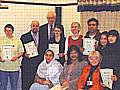 Rochdale shopkeepers who successfully completed the first marketing workshops course are pictured with their certificates, presented after the final workshop. They are pictured with Main Marketing trainers and Esther Shepley (back row, fifth right) of SRB