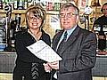 Licensing Manager John Fletcher hands over the new licence to Bar 5 Owner Jayne Warcaba