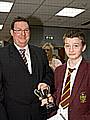 Jack Ryder, Prosecution Lawyer receives the winners’ cup from Martin Hill of Rochdale’s Crown Prosecution Service