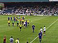 The players leave the pitch after the game at Spotland