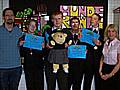 Nigel Ainsworth-Barnes, Key Stage 4 Teacher, Amy Millward, Stephen Walker (with Kay, the school mascot), Andrew Kirby, Stefan Handley and Ve Nutter, Fair Trading Officer, Rochdale Council Trading Standards Service. The students are holding their runners-u