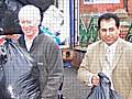 Council Leader Paul Rowen helps to load up the container