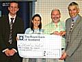 Springhill Hospice staff receiving a cheque for £1,250