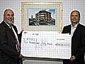 Rochdale Online Director John Kay hands a cheque to RDSFL Chairman Jim Matthews