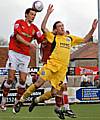 Rory McArdle goes up for a header.