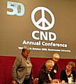 Peace Group members Mai Chatham, Pat Sanchez and Rae Street chatting with CND national chairman Kate Hudson on the platform at the conference on Sunday (19 October).