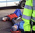 Pat Sanchez lies blocking the gates at the Atomic Weapons Establishment at Aldermaston yesterday morning.