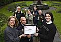 CROP SQUAD: (Front row L-R) Councillor Wera Hobhouse, Andrew Whitehead and Ian Trickett stand proudly with the Green Volunteers’ APSE finalist certificate, with (back row L-R) fellow Green Volunteers John Fleming, Jonathon Kershaw, Taras Melnyk and Frank Harrison.