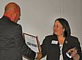 Springhill Head teacher, Annabel Bolt receives the school's Future Schools Award from Bob Harrison.