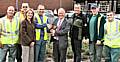 Chief Executive Roger Ellis and Councillor Wera Hobhouse present Middleton’s street services team with the Chief Executive Landscape Award trophy at the winning site opposite the Dusty Miller pub.