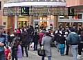 Store staff and customers stand outside the Rochdale Exchange Shopping Centre after it was evacuated this afternoon.