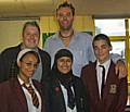 Councillor Dale Mulgrew with Teacher Andy Kennedy and pupils from Springhill High School