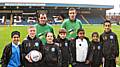 Youngsters from Belfield Community and Heybrook Primary Schools with Dale stars Chris Dagnall and Will Buckley on 'Kick It Out' day at Spotland.