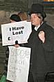 'Scrooge' protests outside the town hall.