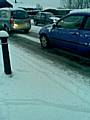 Traffic struggles through the snow on Manchester Road in Castleton.