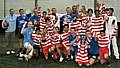 Rochdale Fire service and the young footballers celebrate the success outcome of the match.