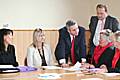 Ivan Lewis MP (standing) talks to Susan Coates (on Mr Lewis' right) and Ellen Wintle-Yates (to Mr Lewis' left) with Simon Danczuk (standing - back), Debbie Abrahams (far left) and Councillor Linda Robinson (far right) listening