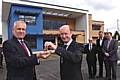 Director of Eric Wright, Mike Collier, hands over the keys to Trevor Purt, Chief Executive of Heywood, Middleton and Rochdale Primary Care Trust, as (L-R) Jim Dobbin MP, Justin Harris from Nightingale Associates and John Pierce, Chair of HMRPCT, look on.