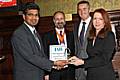 Anasudhin Azeez, Managing Director of New Asian Media Ltd, receives the New Business of the Year award from BBC's Rachel Elnaugh as IAB President Fabian Hamilton, MP, and Alan Moody, Managing Director of Mamut Business Software, look on