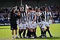 The Dale players celebrate their goal against Shrewsbury at the end of last season by holding up a shirt in tribute to David Flitcroft's father.